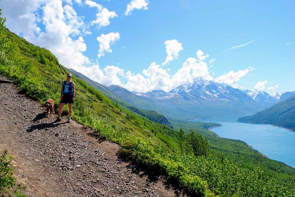 Pepper Peak hiker on a trail in Chugach State Park overlooking Eklutna Lake