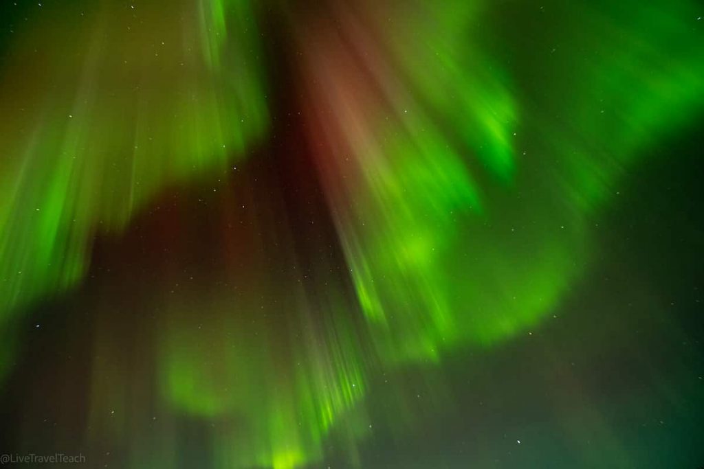 Chasing The Northern Lights Aurora borealis glowing at night
