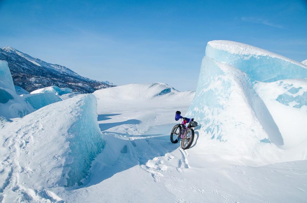 fat bike leaning against large ice formations at the Knik Glacier