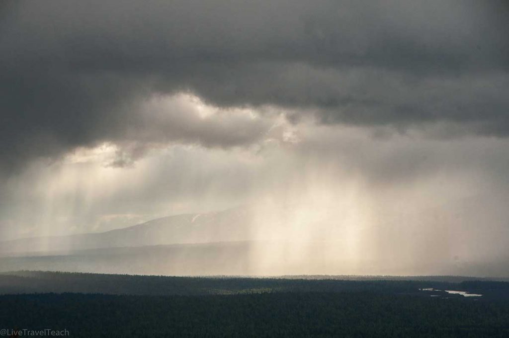 rain shafts falling from dark, heavy storm clouds