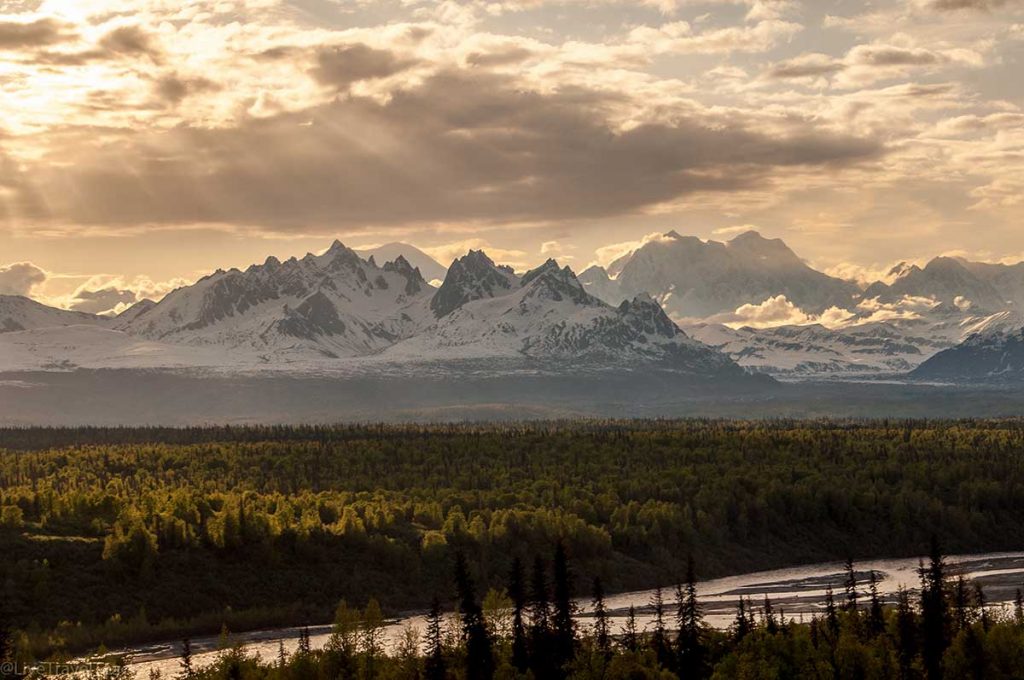 Sunset glows over the Tokosha Mountains in the foothills of Denali