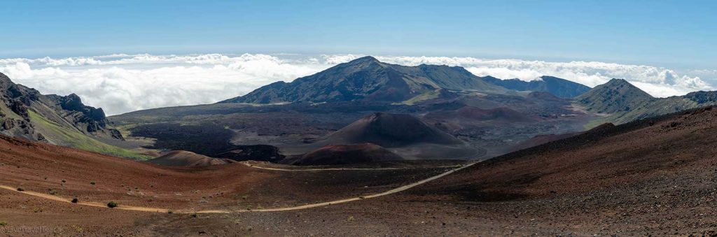 Hiking in Haleakala rugged volcanic features, including cinder cones and ancient lava flows