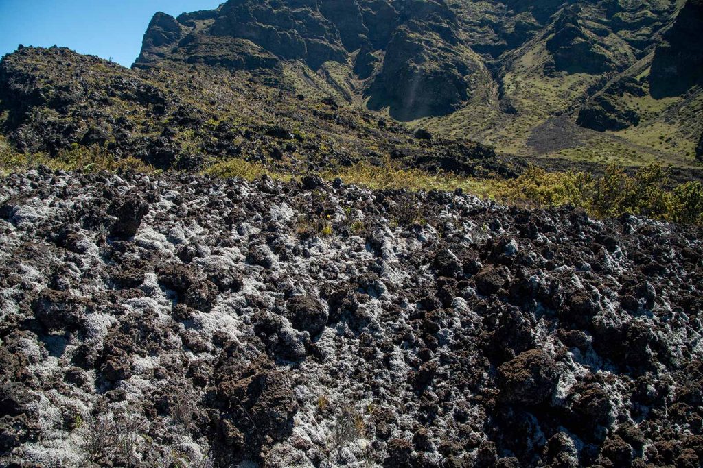 Hiking in Haleakala lava fields with rugged, sharp rock formations