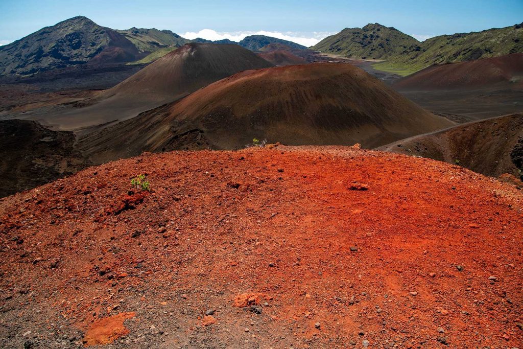 Hiking in Haleakala red cinder cones and rugged volcanic terrain in Haleakala