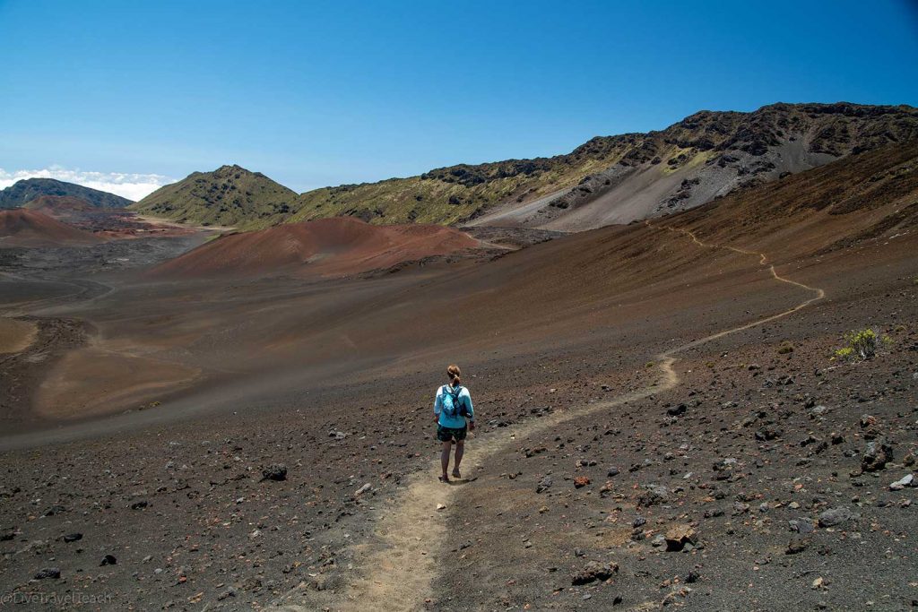 Hiking in Haleakala a hiker on the Sliding Sands Trail