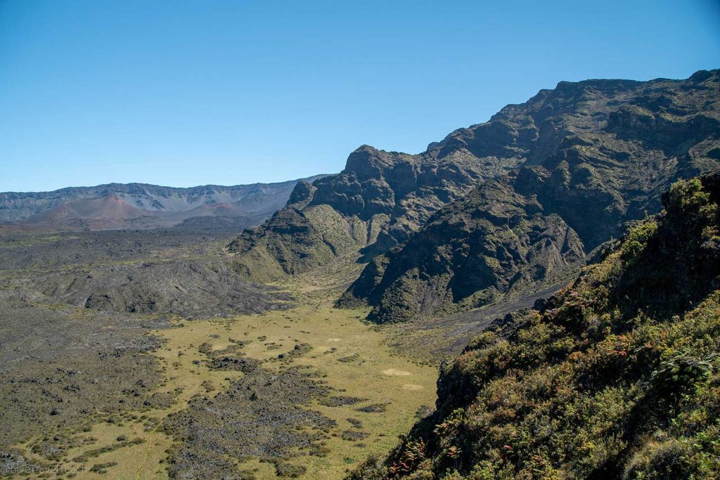 Hiking in Haleakala volcanic plains, lava rock, and grassy patches