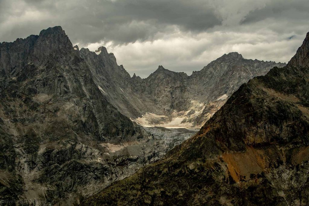Tour du Mont Blanc landscape of mountain peaks under a cloudy sky