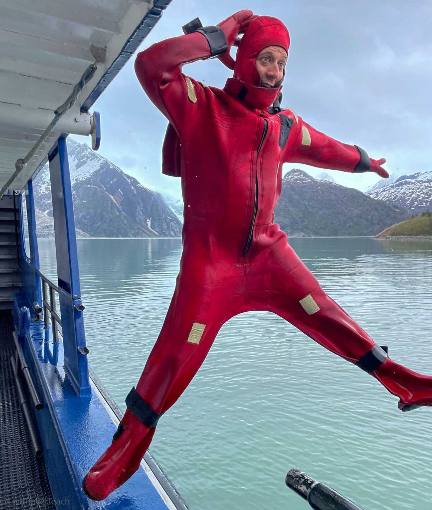 Kenai Fjords Kayak Mike Still jumping off the swim dock