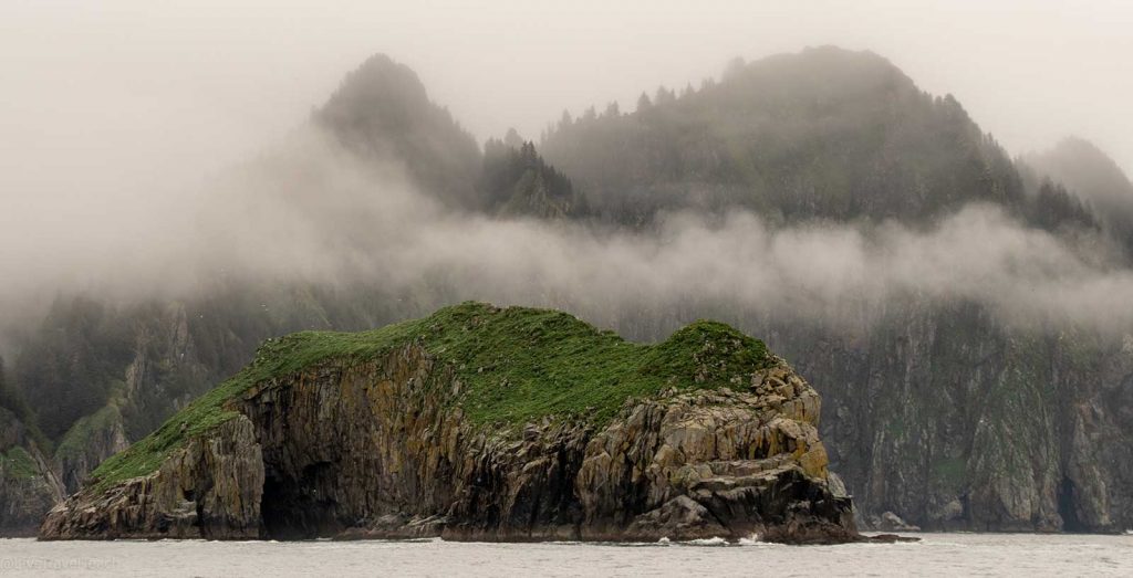 Aialik Glacier Kayaking Glaciers permeated mountains hidden behind the fog