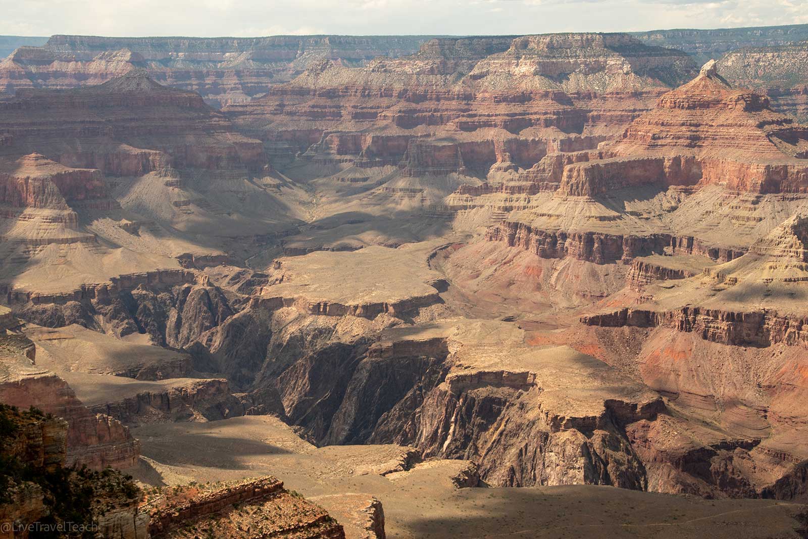 Bright sunny day over the vast Grand Canyon aerial view