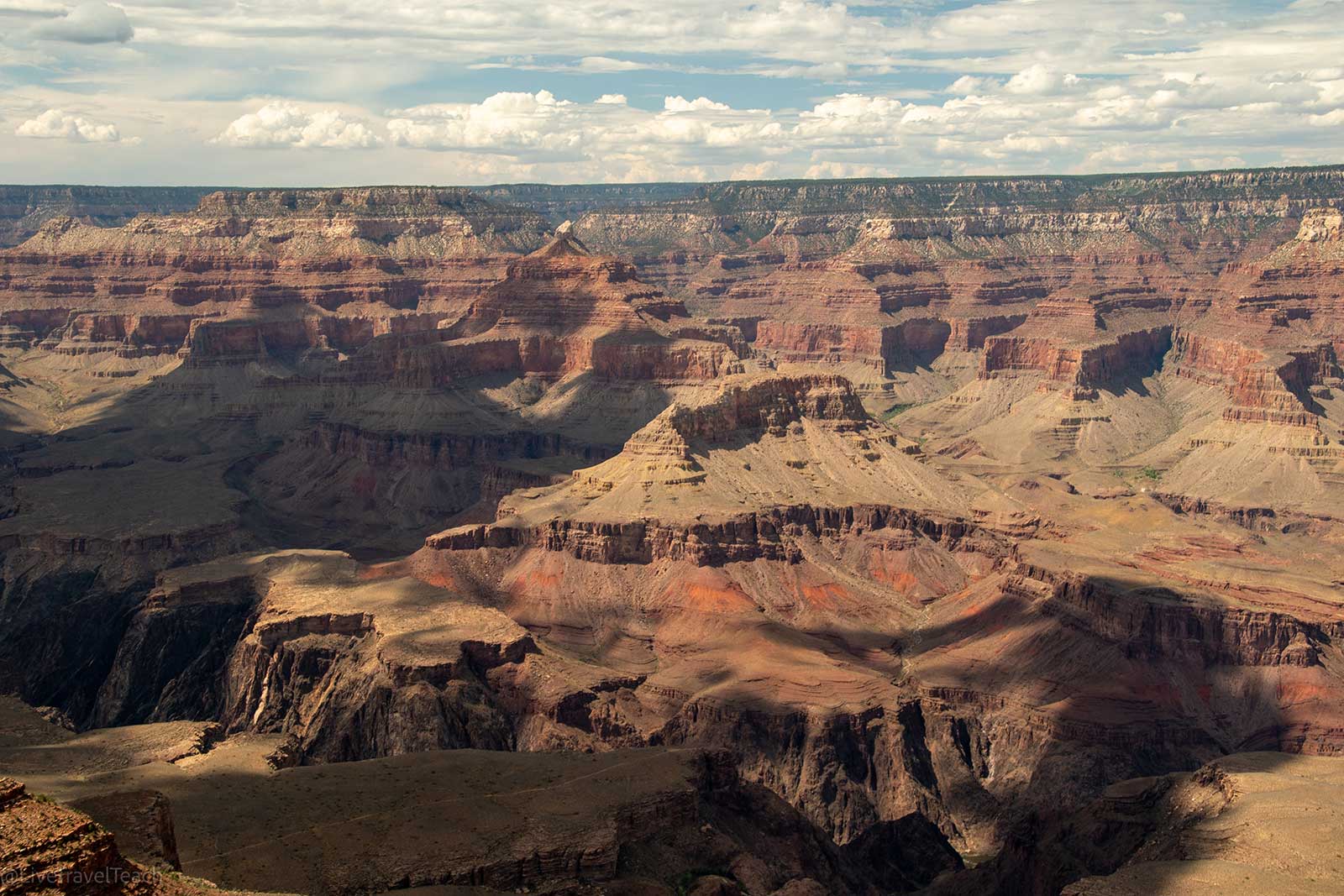 Aerial view of the Grand Canyon under a bright sunny sky