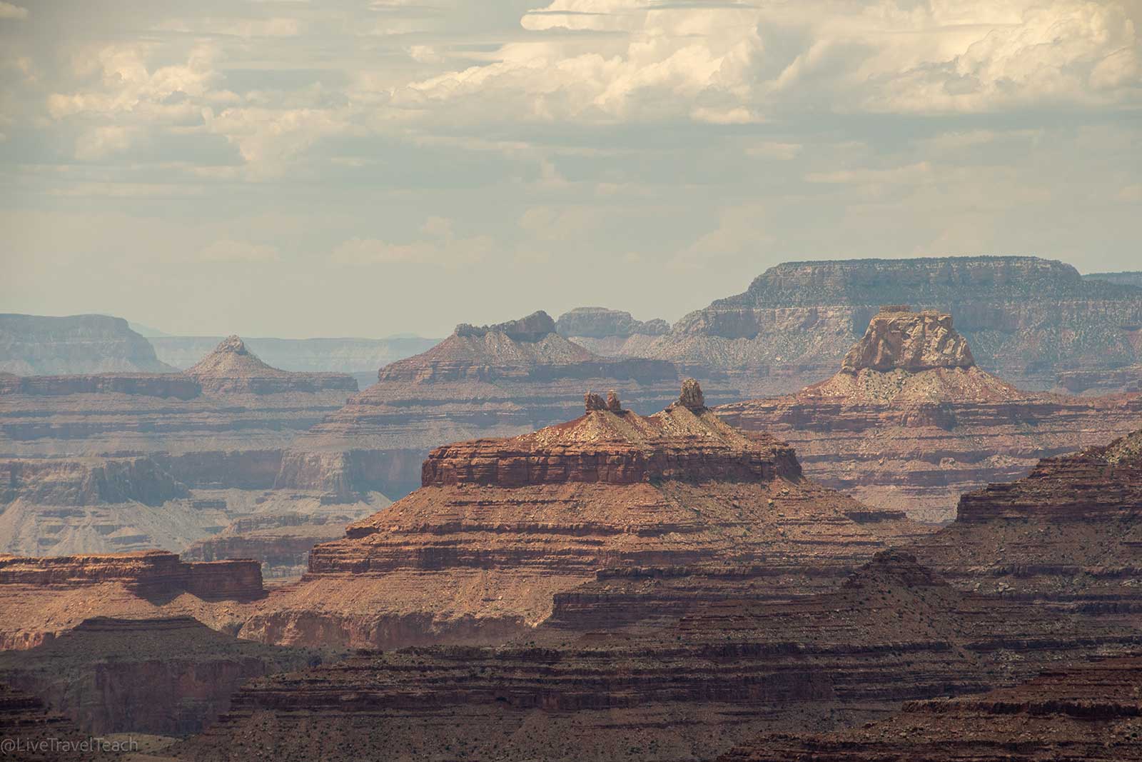 Grand Canyon aerial view highlighting rugged cliffs and sunlight
