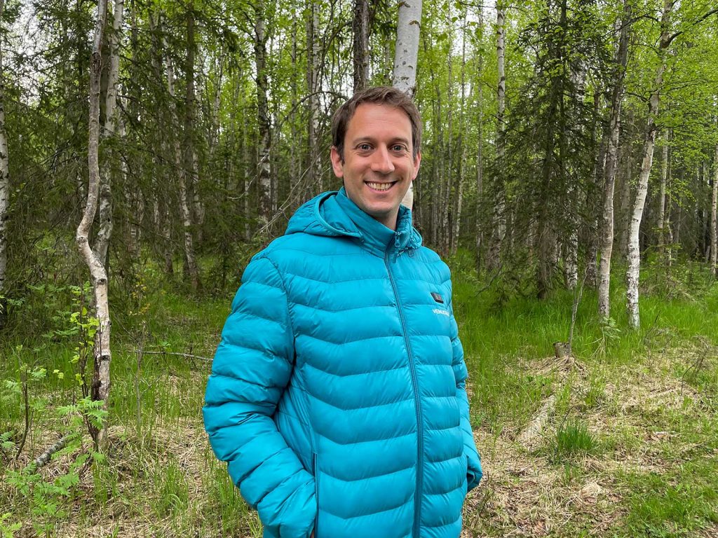 Mike Still wearing a blue Venustas Heated Jacket