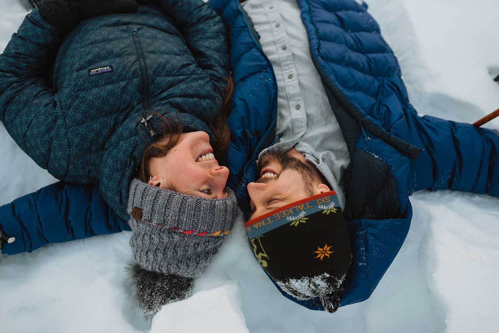 Balancing Life Mike and Elizabeth lying on the snow | Balancing Life Online and Offline