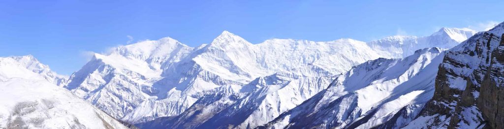 Panoramic view of a snow-covered mountain peak in the Annapurna Circuit
