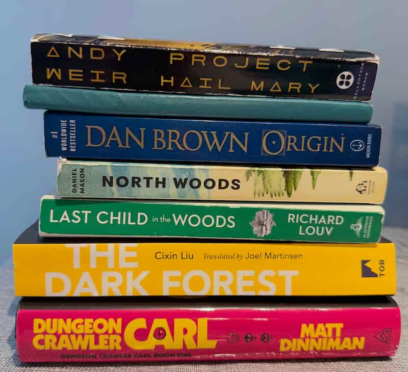 Project Hail Mary Project Hail Mary book placed on top of a stack of other books