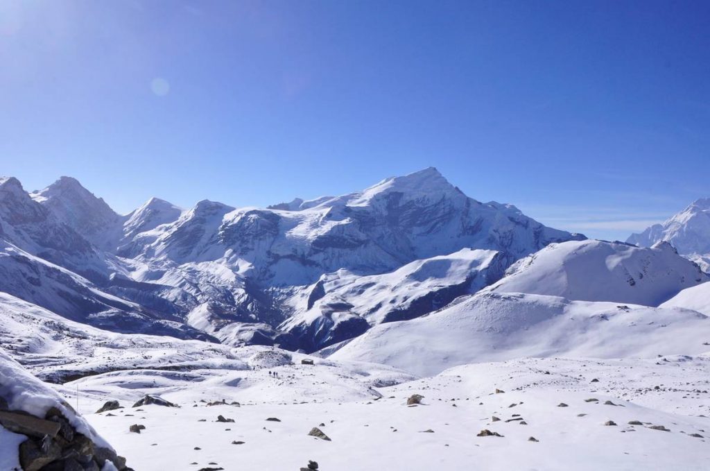 Snow-covered Annapurna Circuit trail while ascending toward Thorong La Pass