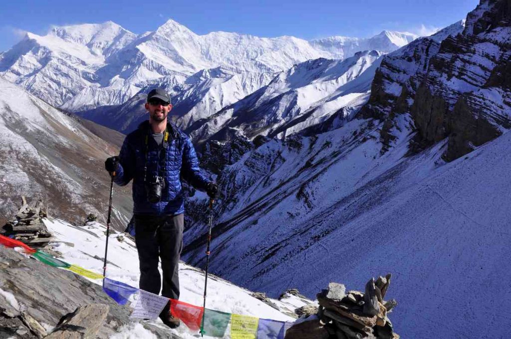 a man trekking on the trail to Thorong Phedi