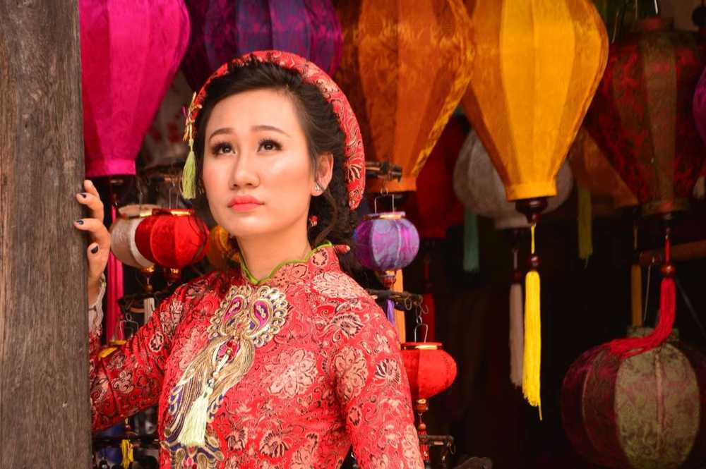 Places to See in Vietnam a woman wearing Vietnamese clothing