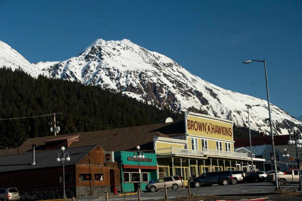 Brown & Hawkins building against a snow-capped mountain